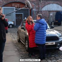 PHD's cover coat on set with the cast of Coronation Street